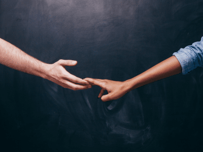 Partners reaching for each other