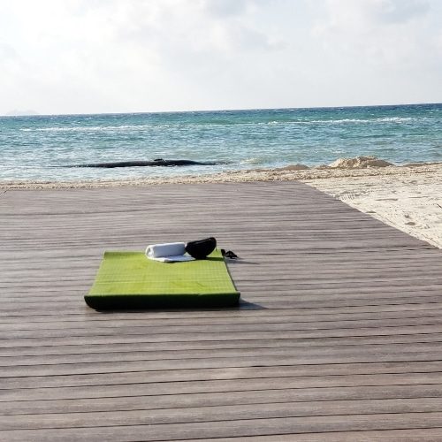 Yoga mat image Yoga mat on pier at the beach