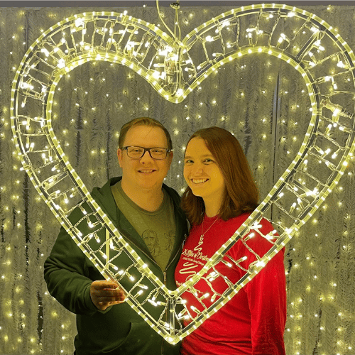 Jenny G and partner Jenny G and partner behind gold heart